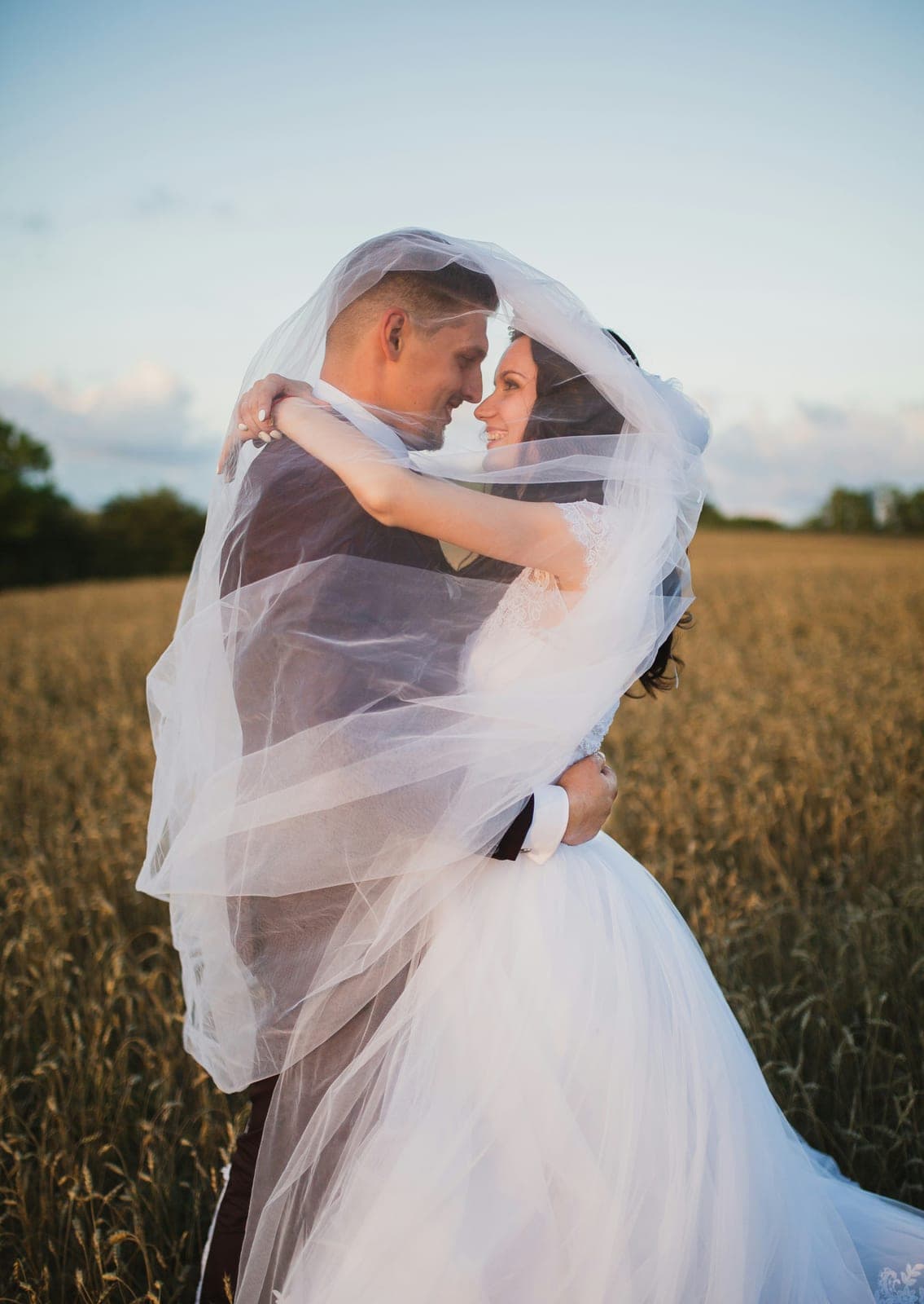 Couple walking hand in hand during an engagement session