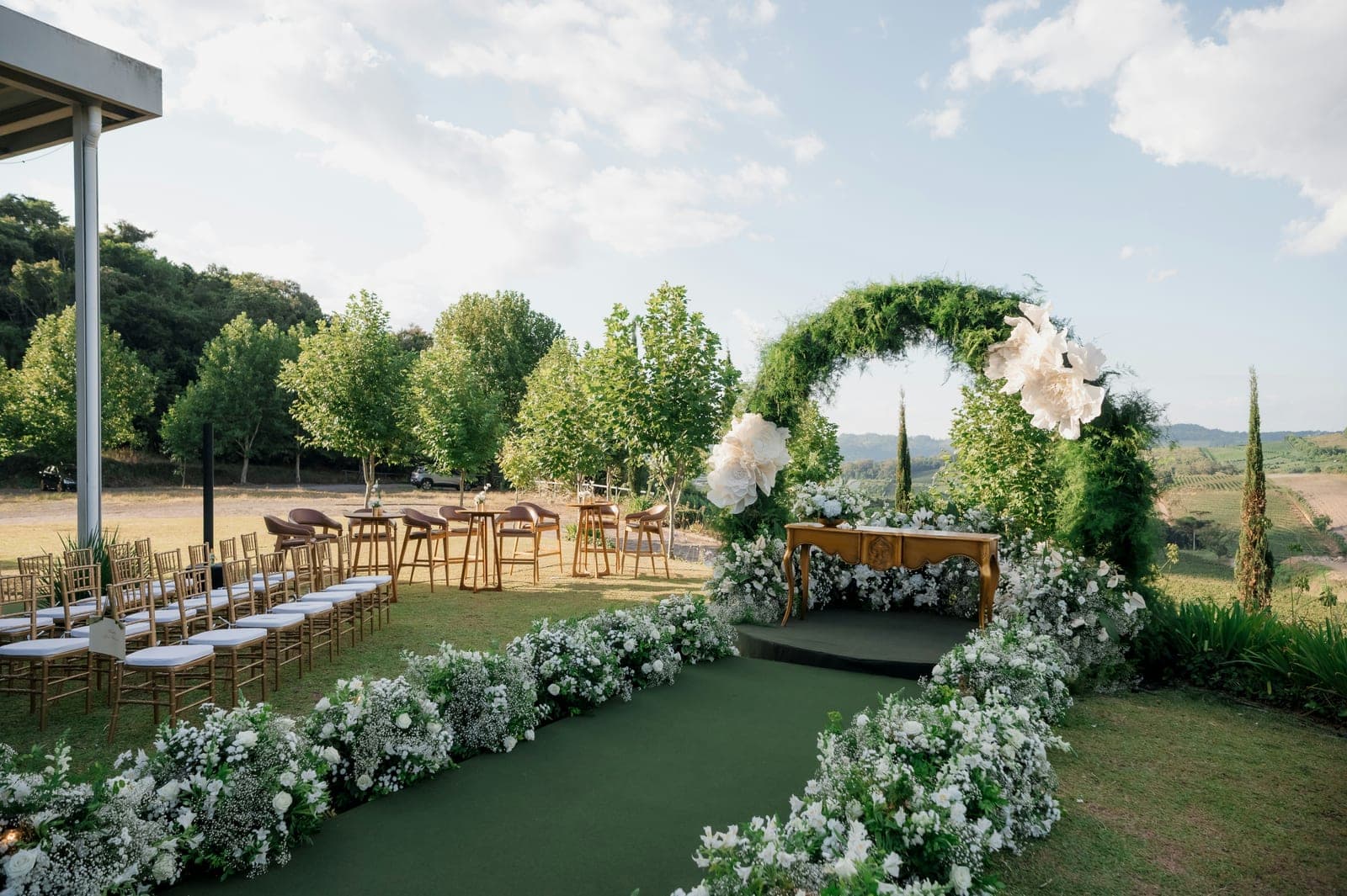 An outdoor wedding venue set for a ceremony